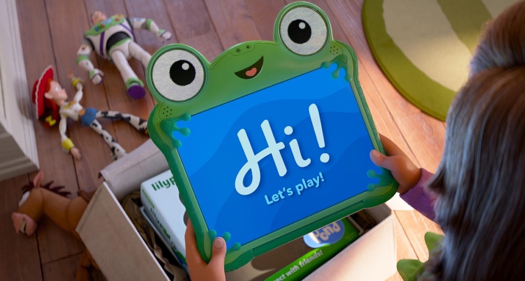 A green computer tablet with human-looking eyes displays a message: Hi! in a poster advertising Toy Story 5, a new movie from Pixar and Disney.